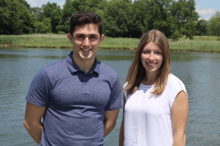 Michael Marinelli and Victoria Long standing in front of a lake